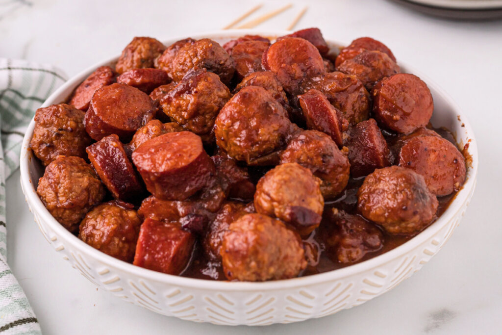 cooked cranberry chipotle meatballs and sausage in white bowl