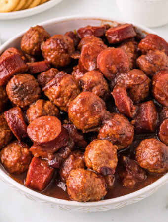 cranberry chipotle meatballs and sausage in white bowl