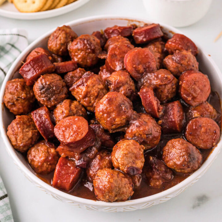 cranberry chipotle meatballs and sausage in white bowl