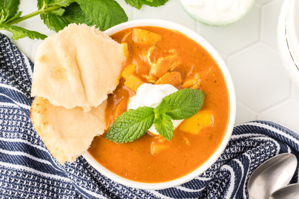 looking down into a bowl of indian spiced chicekn potato stew