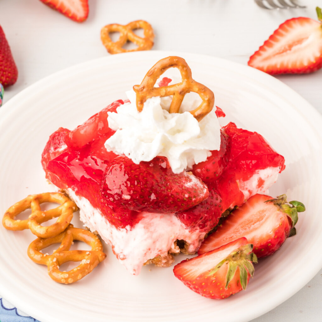 strawberry pretzel salad slice on plate