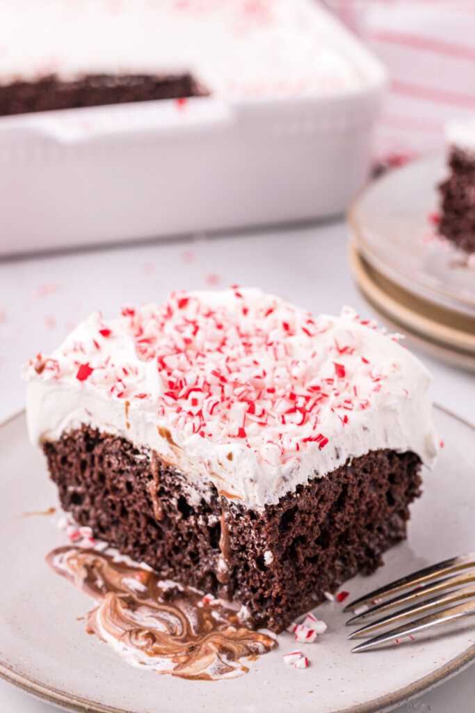 slice of peppermint poke cake on plate