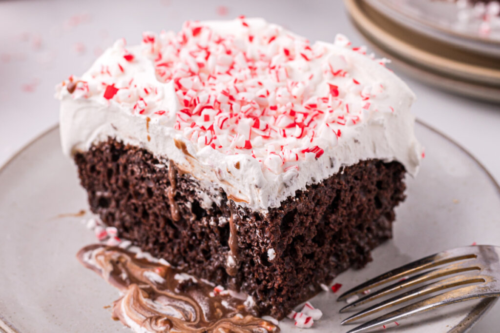 slice of peppermint poke cake on plate