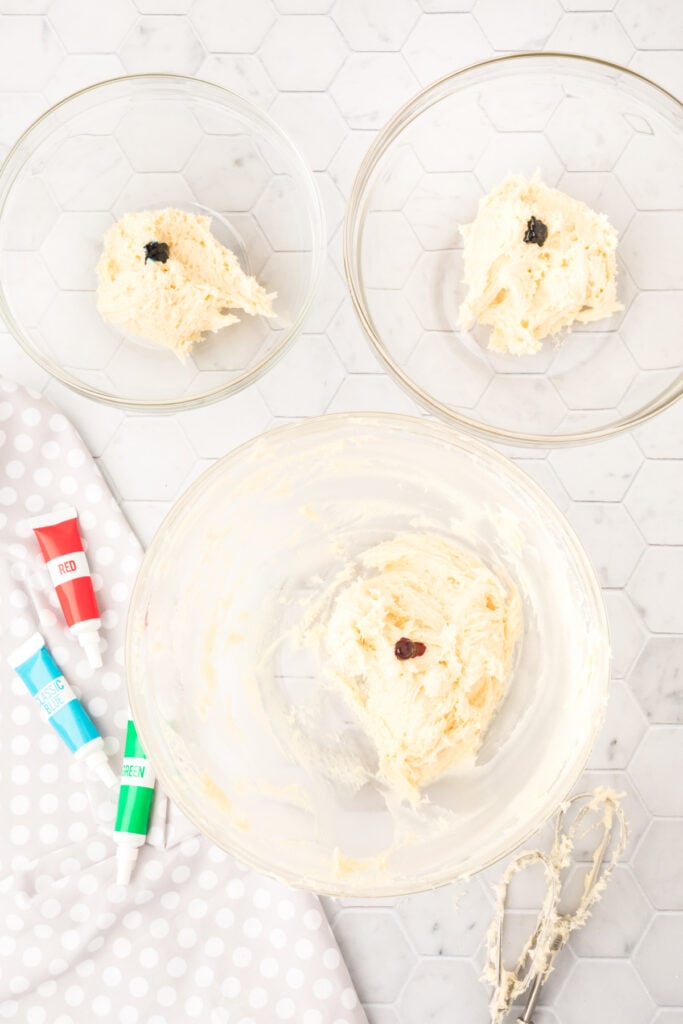 Food coloring gel added to each of the three bowls of cookie dough