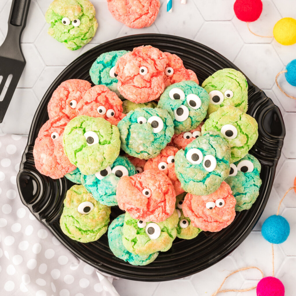 plate full of colorful monster eye cookies