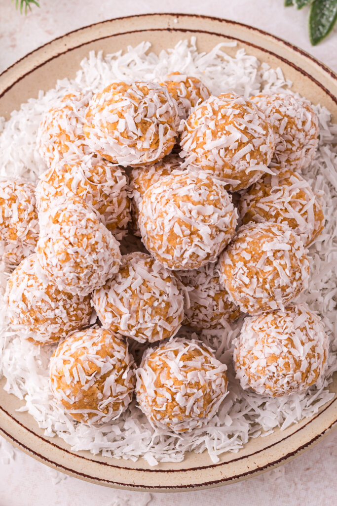 looking down onto a plate full of coconut snowballs