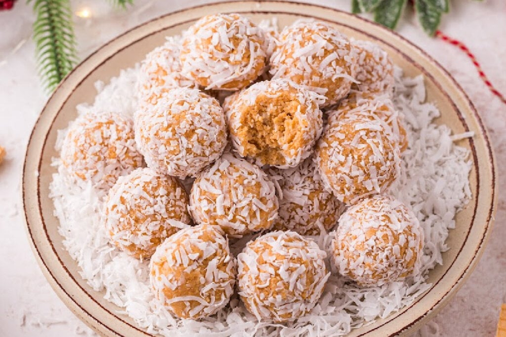 coconut snowballs stacked on plate