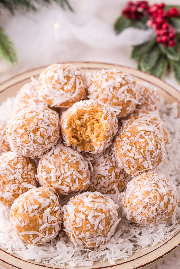 closeup of coconut snowball with bite taken out