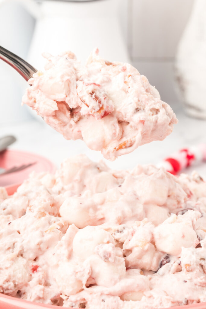 cranberry fluff salad on spoon