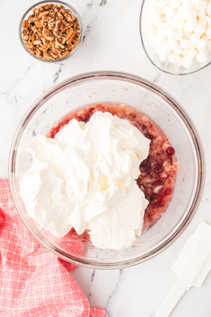fold the whipped topping mixture into the cranberry mixture