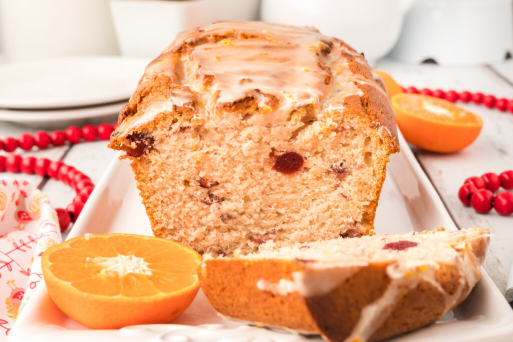 loaf of glazed orange cranberry quick bread