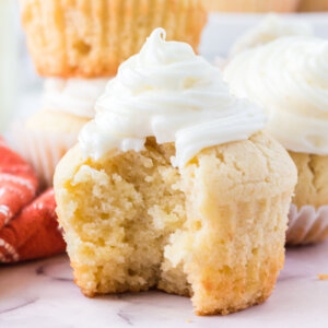 closeup of eggnog cupcake with bite taken out