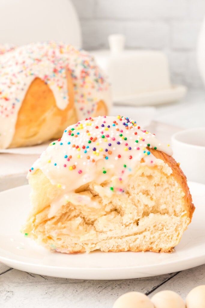 frosted italian anise bread slice on white plate