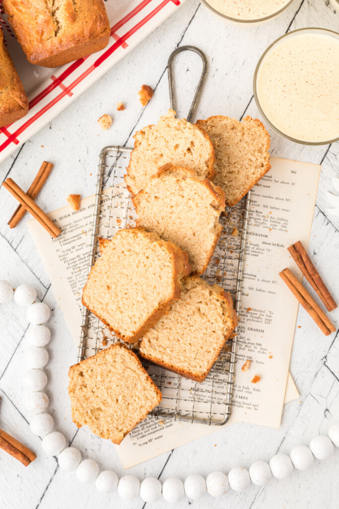 slices of holiday eggnog bread sliced and arranged on cooling rack