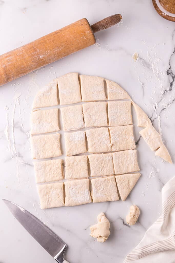 Rolled dough cut into squares for homemade Texas Roadhouse rolls