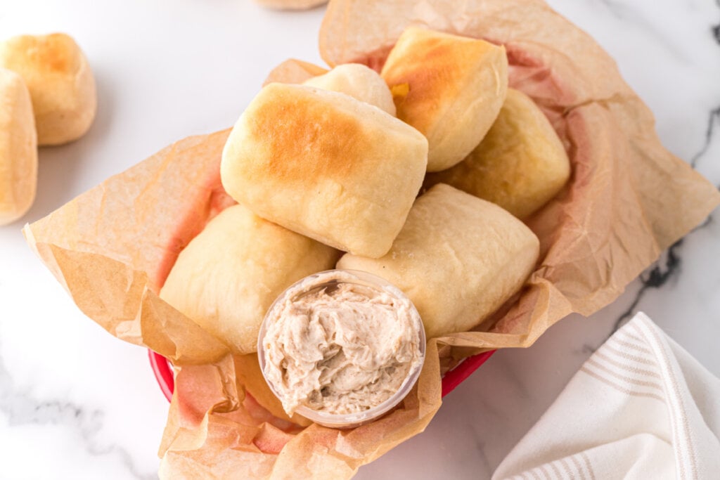 looking down into a basket of copycat texas roadhouse rolls