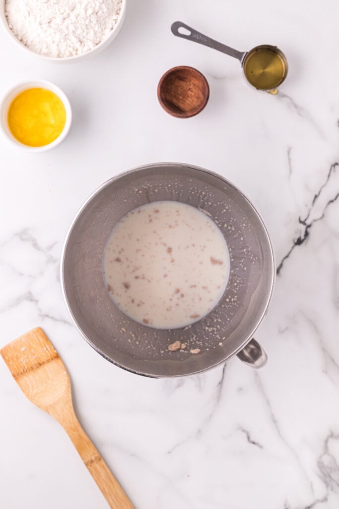 Activated yeast mixture in a mixing bowl for Texas Roadhouse rolls