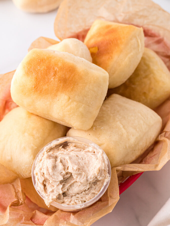 rolls in basket with cinnamon butter