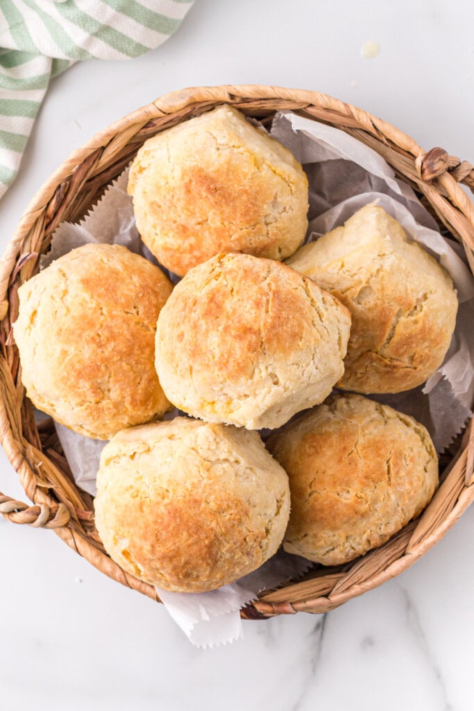 looking down onto a basket full of cheese biscuits