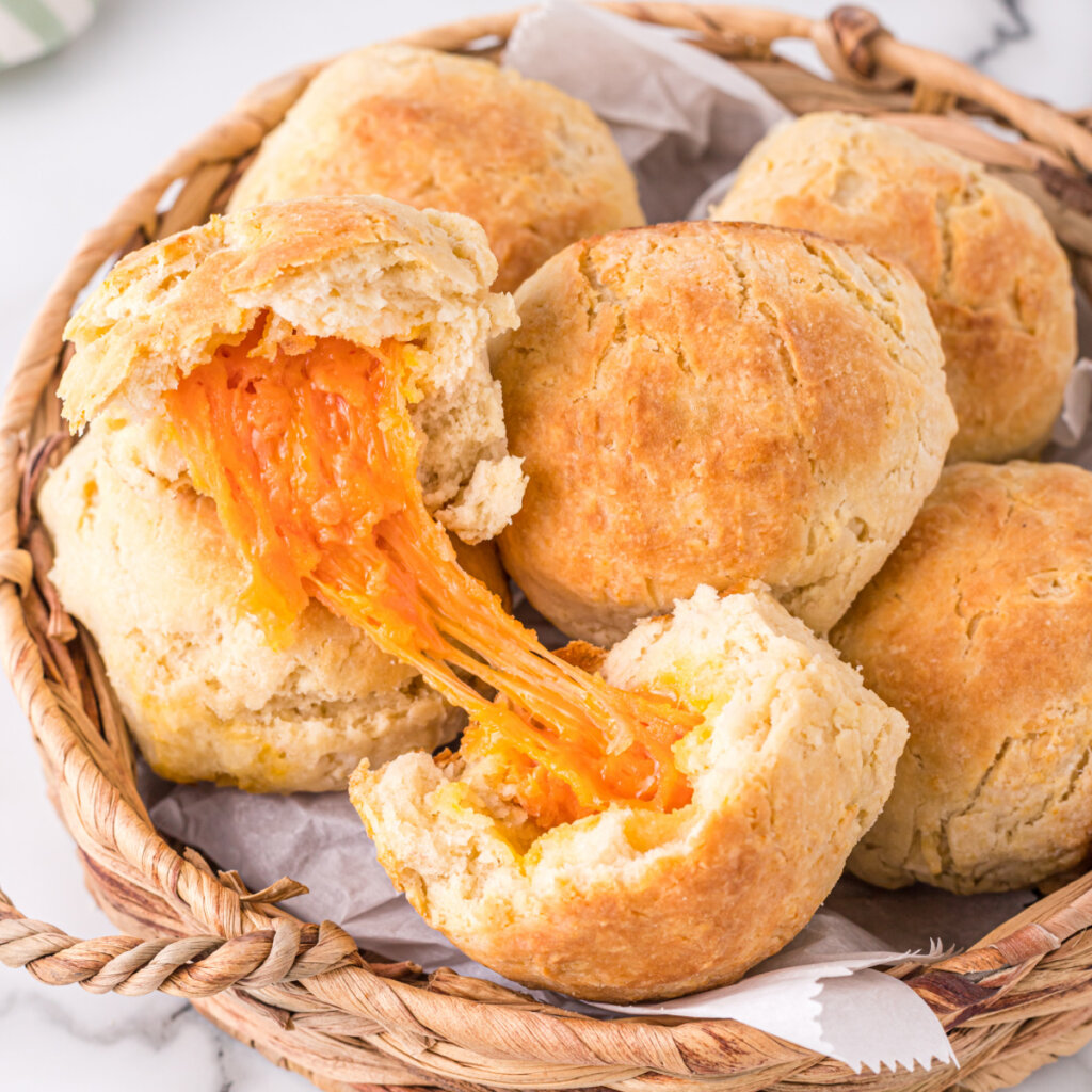 closeup of cheese biscuit showing the melted cheese inside