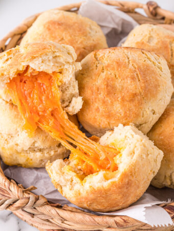 closeup of cheese biscuit showing the melted cheese inside