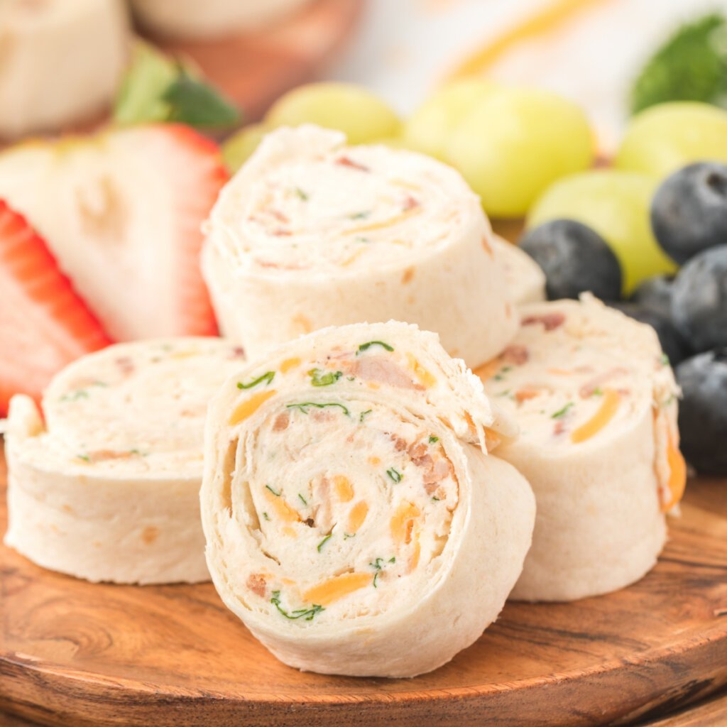 chicken bacon ranch tortilla roll-ups on wooden board