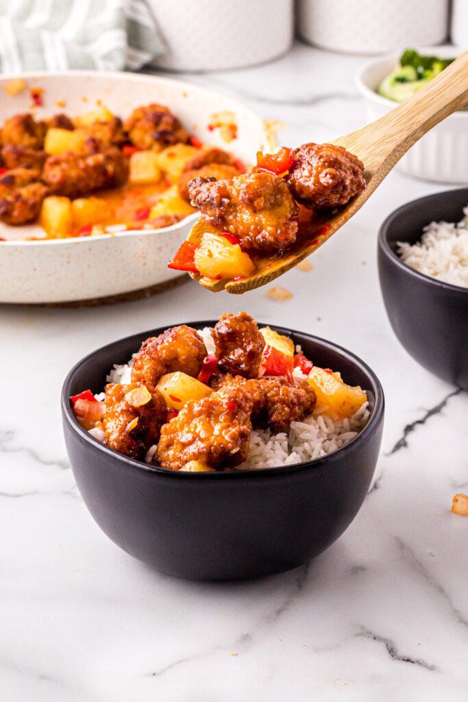 putting sweet fire chicken into a bowl