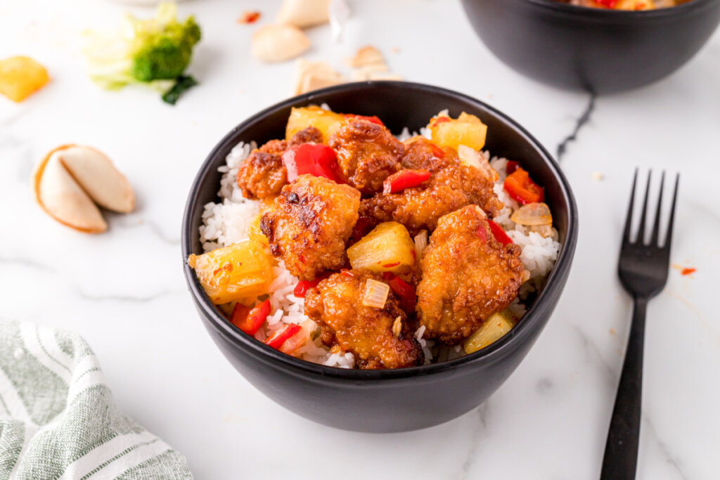 copycat sweet fire chicken in black bowl