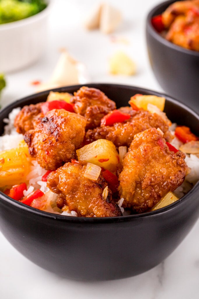 closeup of copycat panda express sweet fire chicken in black bowl