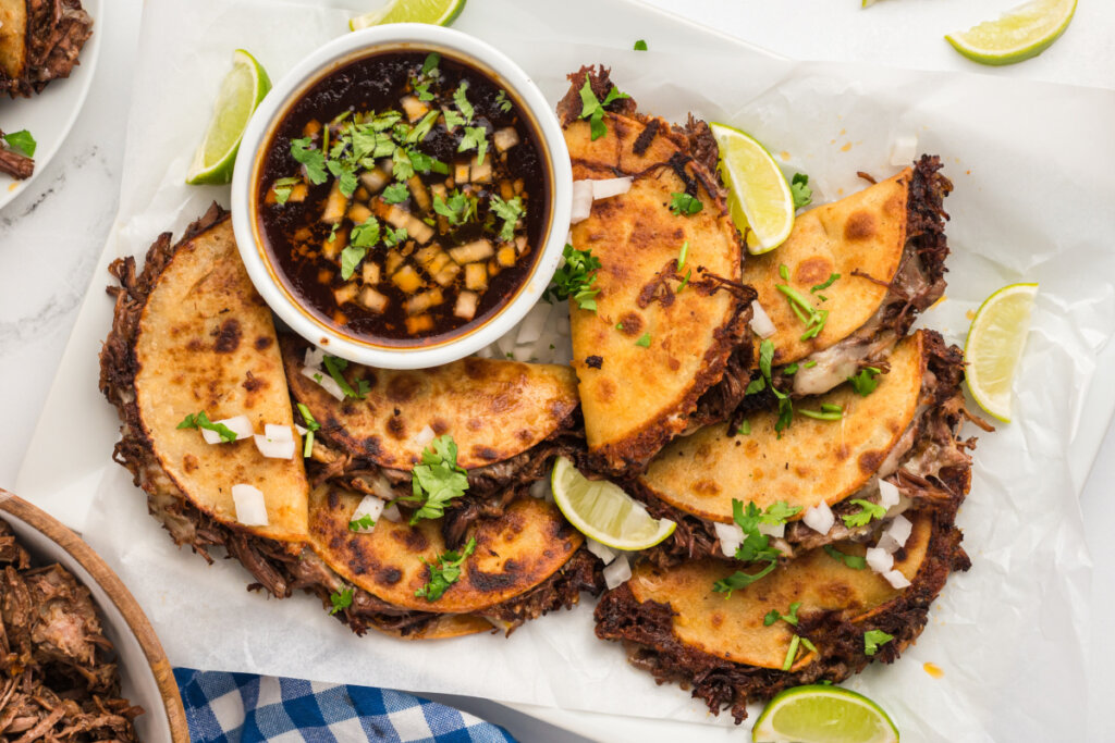 looking down onto platter with birria tacos