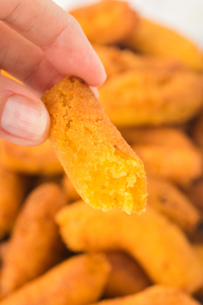 hand holding a carolina hush puppy