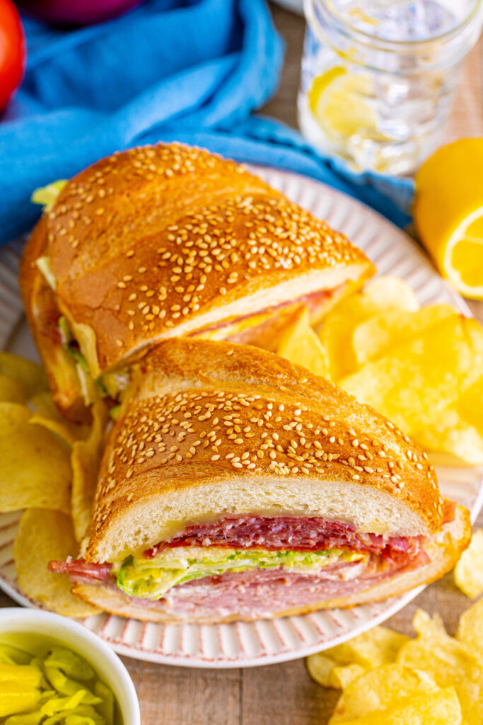 sandwich pieces on plate with chips