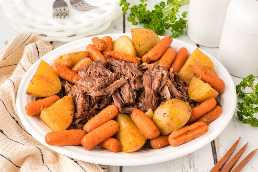 pot roast with potatoes and carrots on serving platter