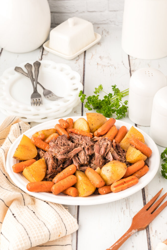 pltter with old fashioned pot roast and potatoes and carrots