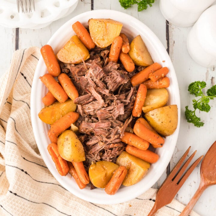 pot roast with carrots and potatoes on platter
