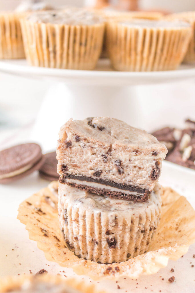 two oreo cheesecake cupcakes stacked