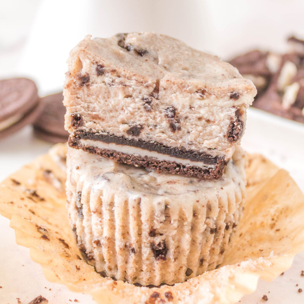 two oreo cheesecake cupcakes stacked