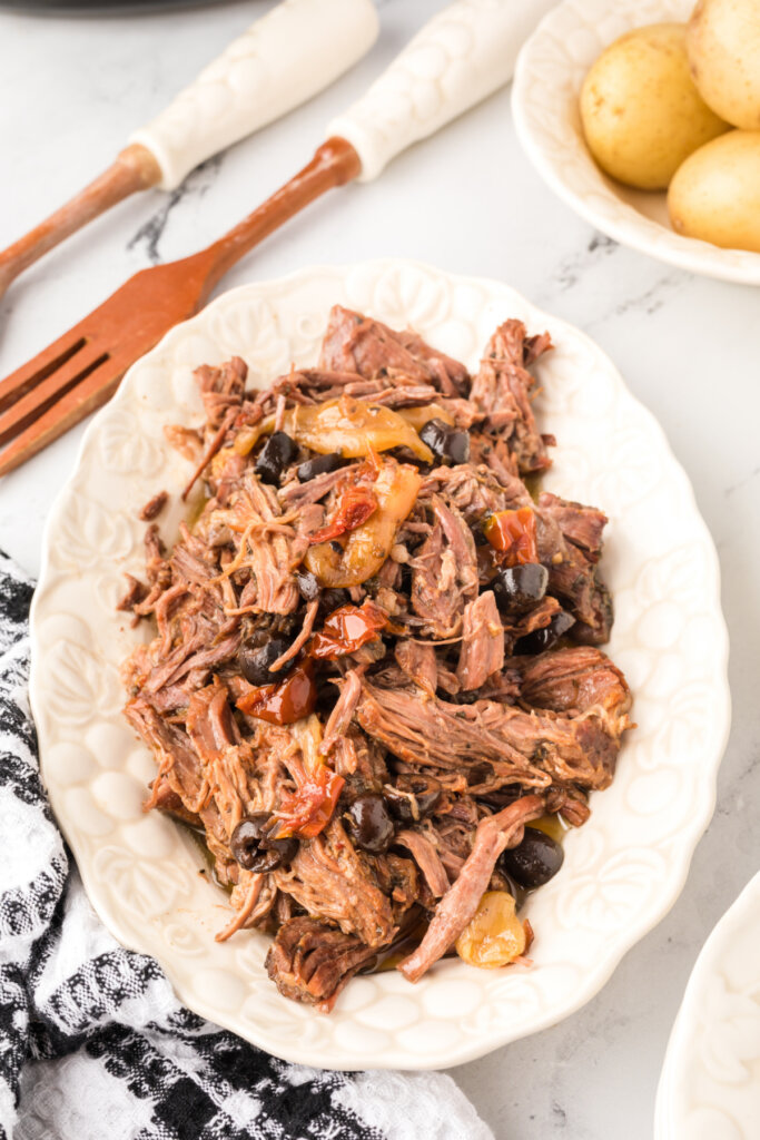 slow cooker mediterranean pot roast on serving platter