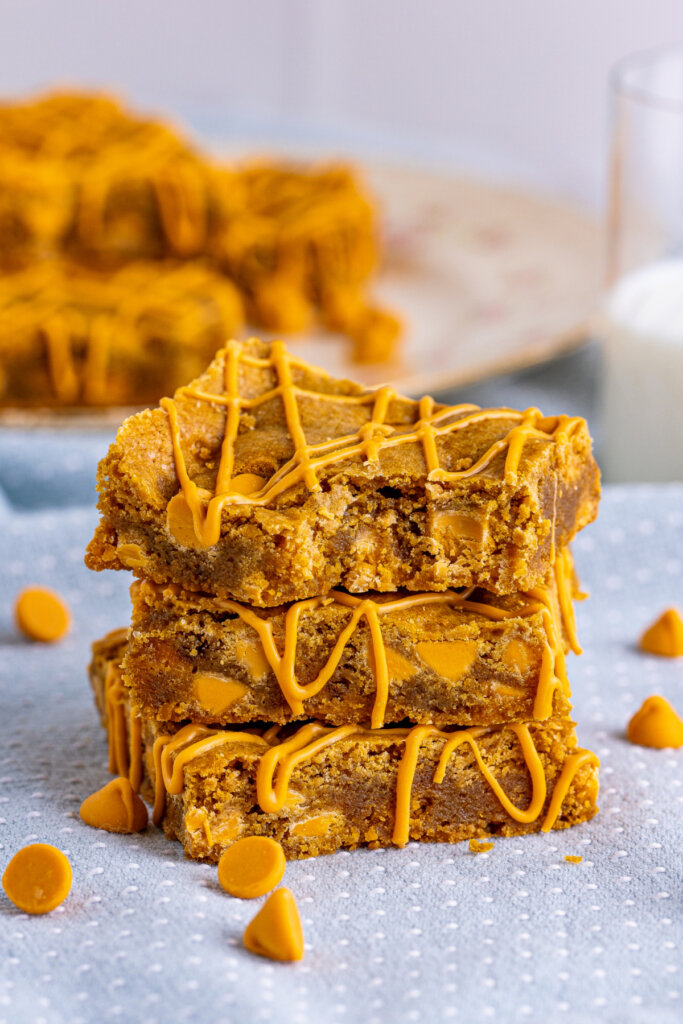 three butterscotch blondies stacked on topof each other