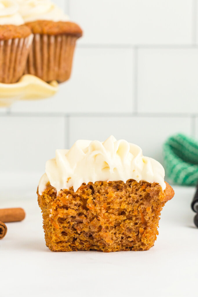 cross-section of carrot cupcake with cream cheese frosting