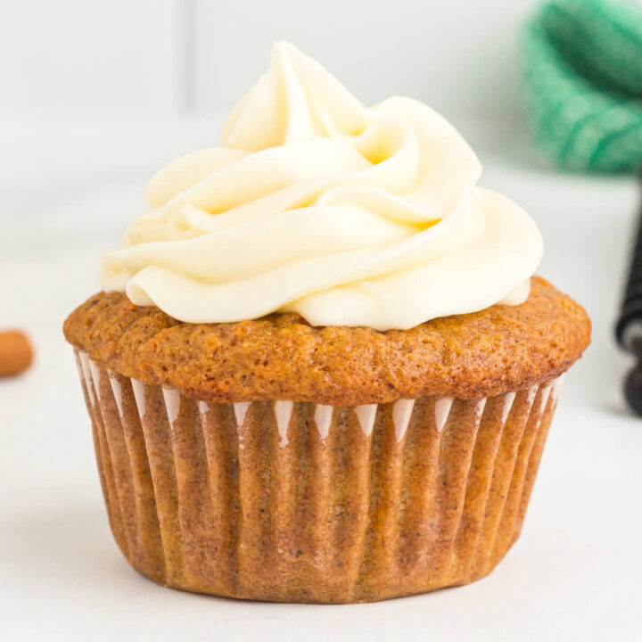 single carrot cupcake with cream cheese frosting