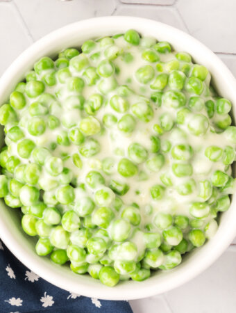 white bowl with creamed peas