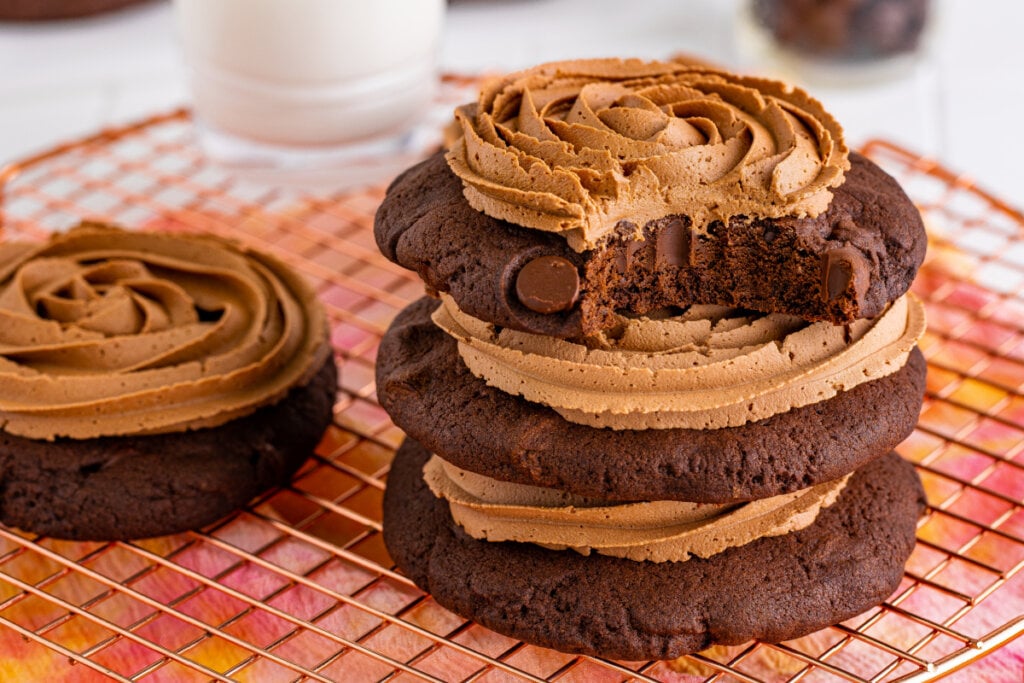 three stacked chocolate cake cookies with a bite taken out of the top cookie