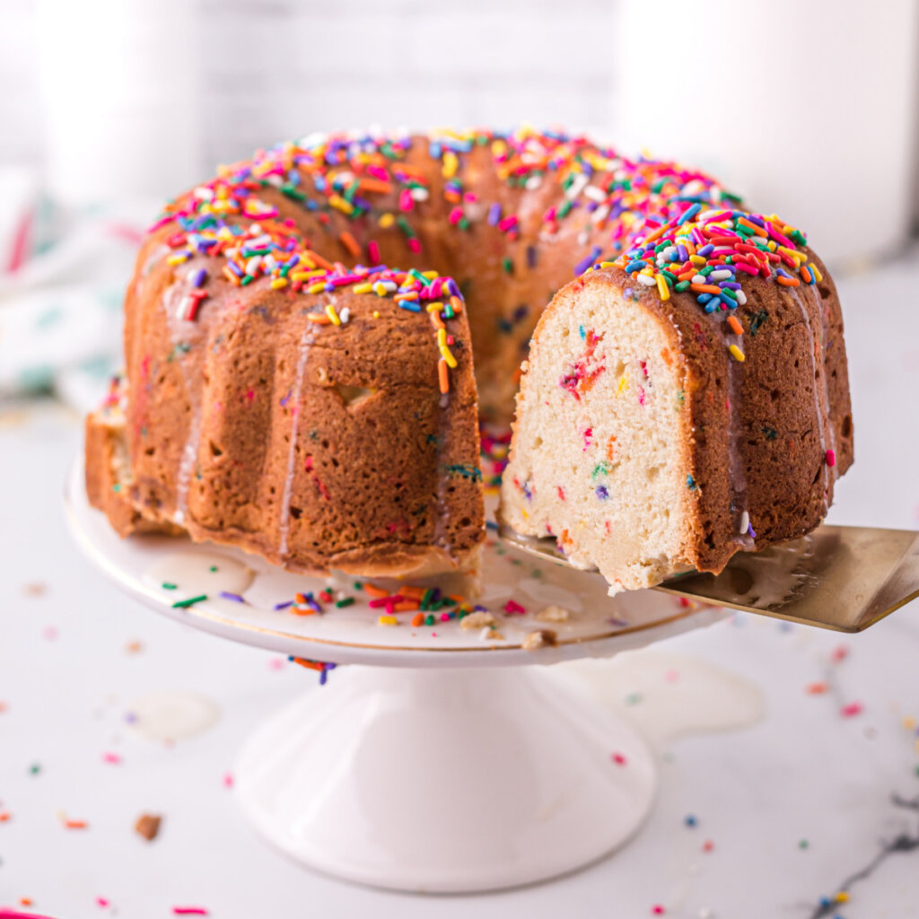 sliced funfetti pound cake on cake stand