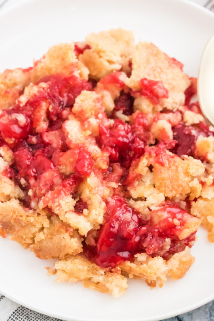 closeup of strawberry dump cake on plate