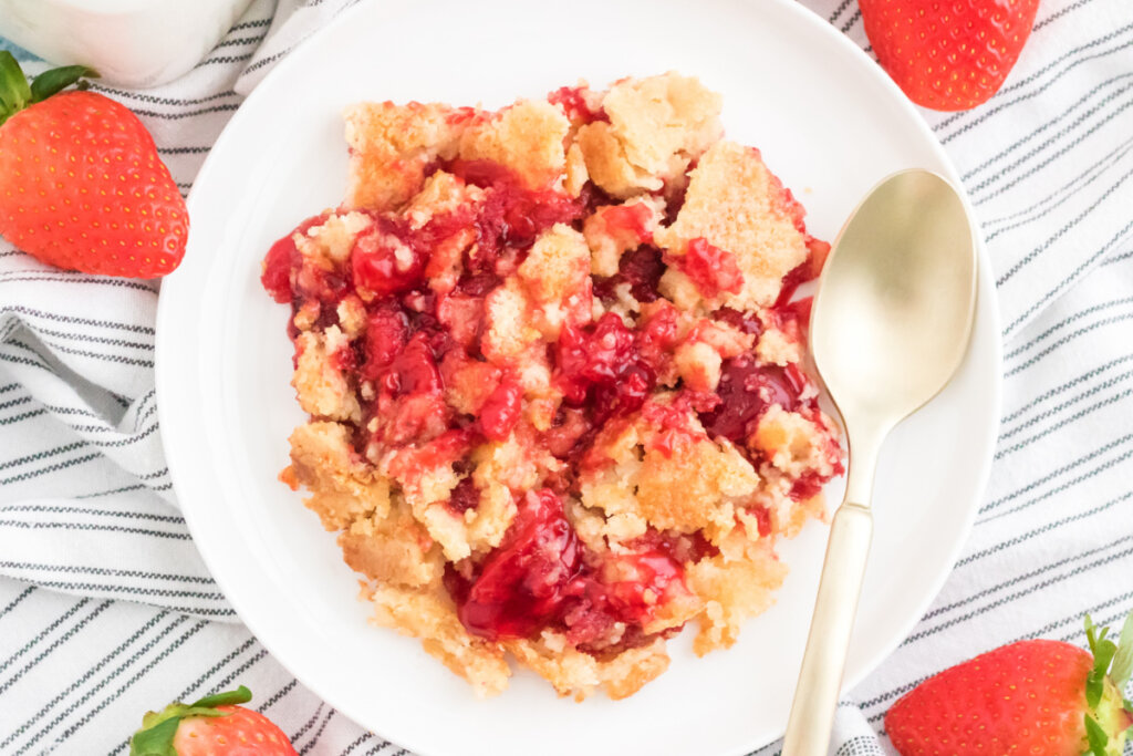 looking down onto a plate with a portion of strawberry dump cake