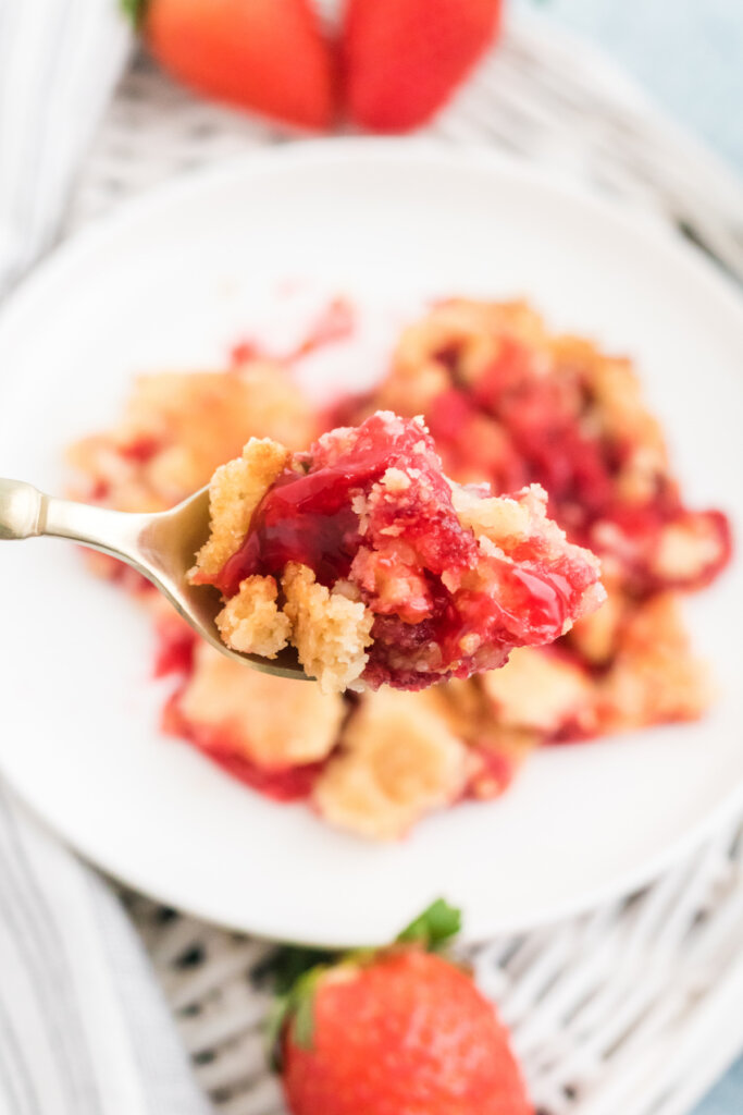 bite of strawberry dump cake on spoon