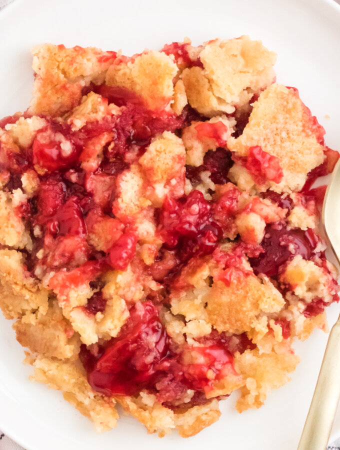 closeup of strawberry dump cake on plate