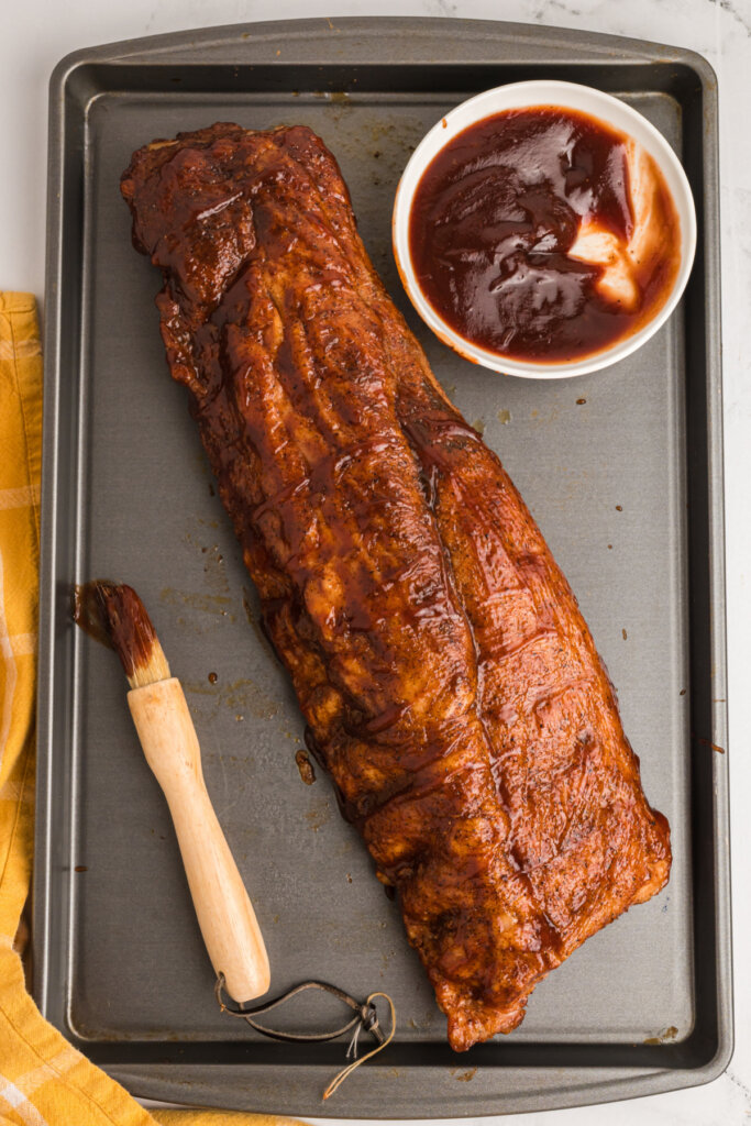 finished rack of ribs on a baking sheet