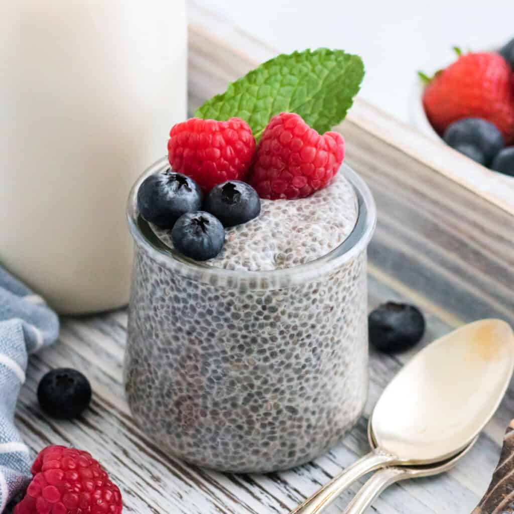 chia seed pudding in jar garnished with fresh fruit